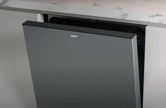 Built-in dishwasher with the door partly open